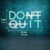 A glowing blue neon sign spelling out DON'T QUIT on a textured dark wall.