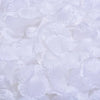 White silk rose petals scattered on a surface for weddings, parties, and home decor