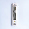 A vertical box for a set of six metallic twisted coil birthday candles.