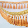 Golden orange tassel fringe trim used for curtains and DIY projects