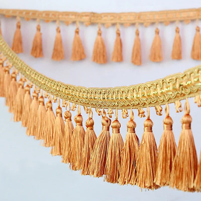 Golden orange tassel fringe trim used for curtains and DIY projects
