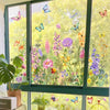 Window decals featuring colorful butterflies and flowers on a glass pane.