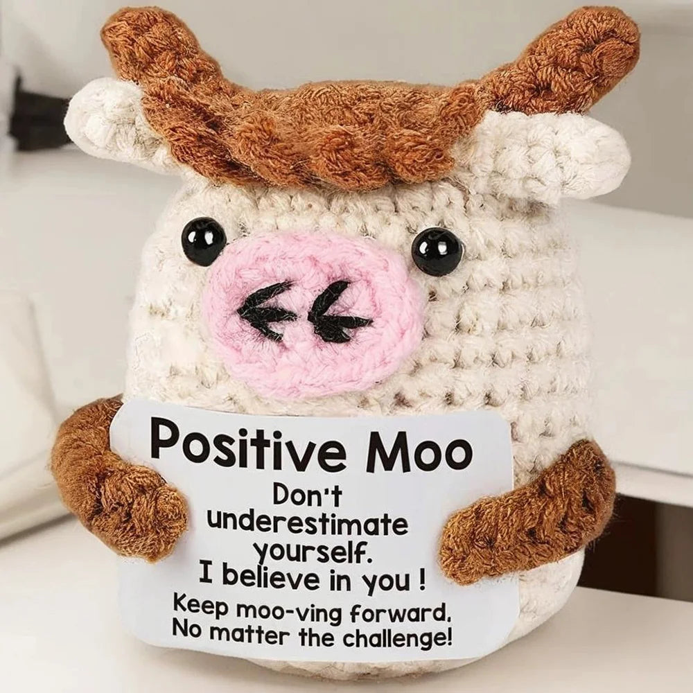 Handmade crochet potato doll with brown and white fur and an inspirational card
