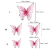 Three butterfly cake toppers in pink shades labeled L, M, and S showing different sizes.