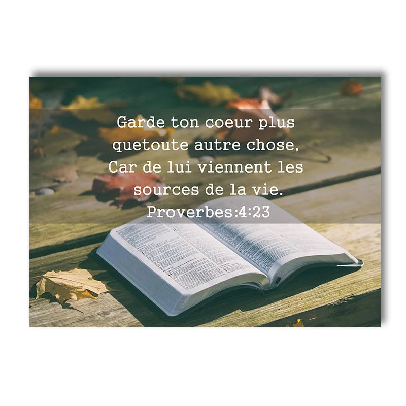 A close-up of an open Bible resting on a wooden surface with autumn leaves in the background.