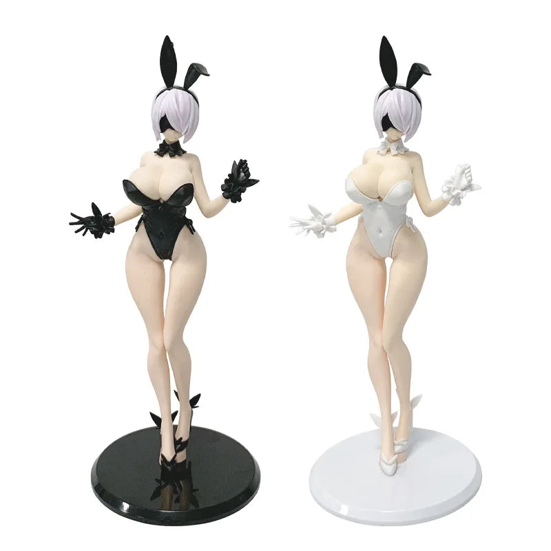 A collectible figure of an anime-style mechanic girl with white hair, wearing a black outfit and a white outfit.