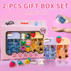 A set of two gift box hand spray bottles with various floral and fruit scents displayed on a pink background.