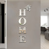 Silver wall decals shaped like letters spelling HOME and a butterfly