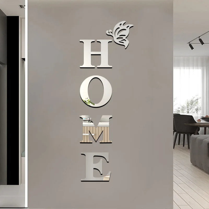 Silver wall decals shaped like letters spelling HOME and a butterfly