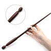 A brown metal magic wand with a decorative handle is shown being held, with an inset showing the tip.