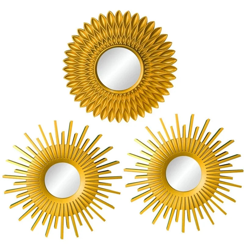 A set of three gold sunflower wall mirrors with reflective surfaces.