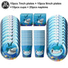 A set of blue shark foil balloons and plates including 7 inch and 9 inch plates, cups, and napkins for an ocean-themed party.