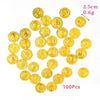 A collection of 100 gold-colored pirate coin party favors, measuring 2.5cm in diameter and weighing 0.6g.