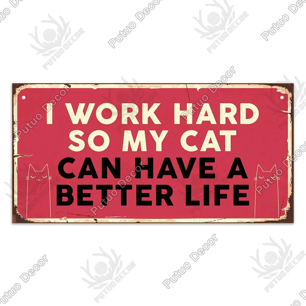 A rustic red wooden sign with white text that reads I work hard so my cat can have a better life