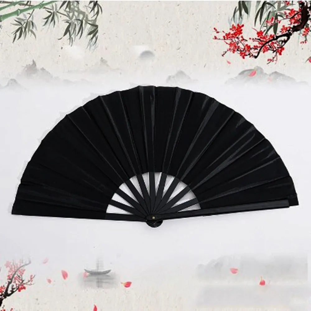 Black Tai Chi performance fan with durable plastic ribs shown against a soft, misty background.
