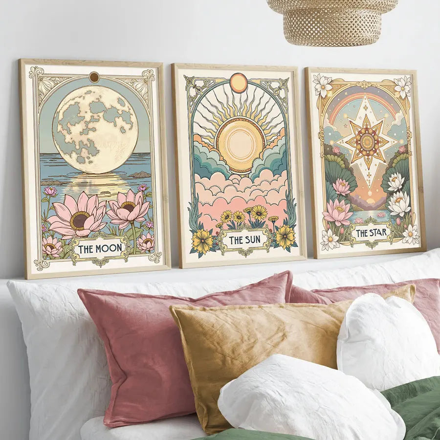 A set of three framed celestial tarot floral art prints featuring the moon sun and star
