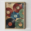 A framed canvas art print featuring various colored vinyl records with labels and text.