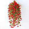 A cascade of bright red artificial morning glory hanging vines.