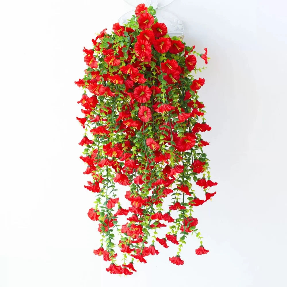 A cascade of bright red artificial morning glory hanging vines.