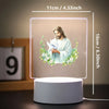 A square 3D LED night light featuring a depiction of Jesus with a wreath of flowers on a light background.