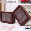 A wooden money box with a grid tracker for savings goals is shown on a white surface.