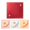 A set of three sheets of pink and peach floral wrapping paper with gold accents.