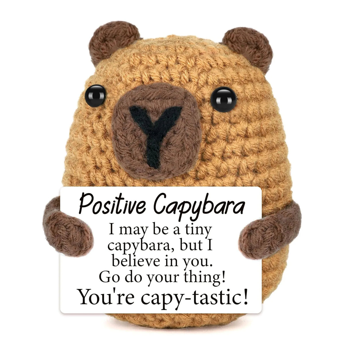 A handmade crochet capybara figurine with an inspirational card that says I may be a tiny capybara but I believe in you go do