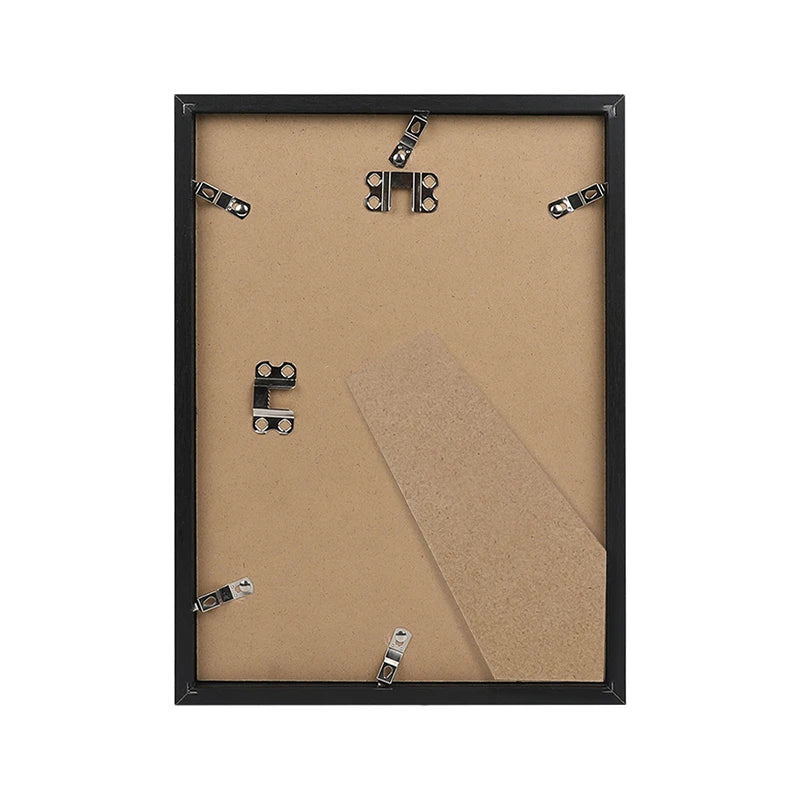 A black wooden photo frame with a light brown background and four small metal clips for mounting photos.