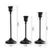Set of three elegant black metal candlesticks for wedding and holiday décor