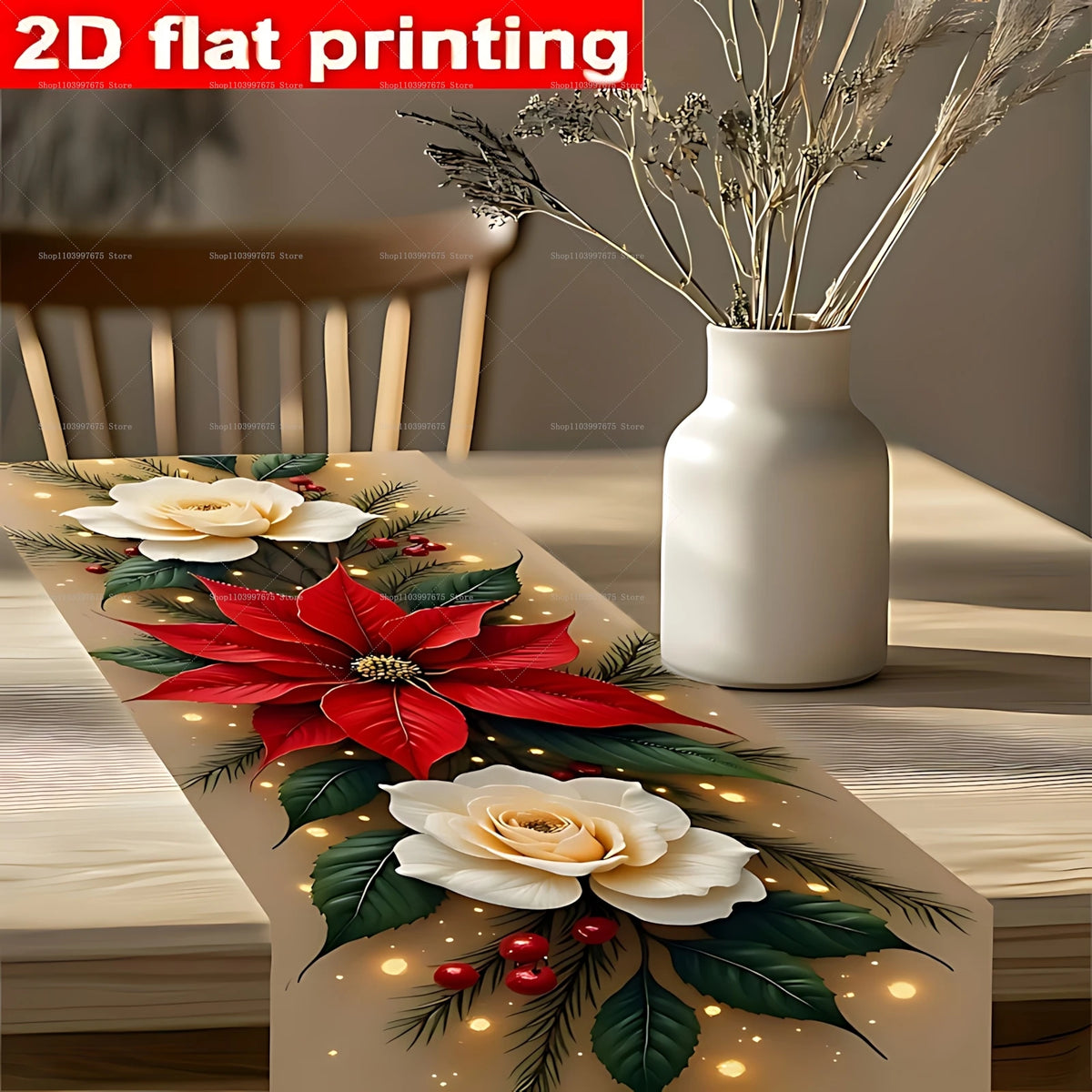 A close-up of a festive poinsettia and pine needle print table runner featuring red leaves and white flowers.