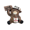 A brown cow figurine wearing a hat and holding a sign that reads Coffee for desk decor.
