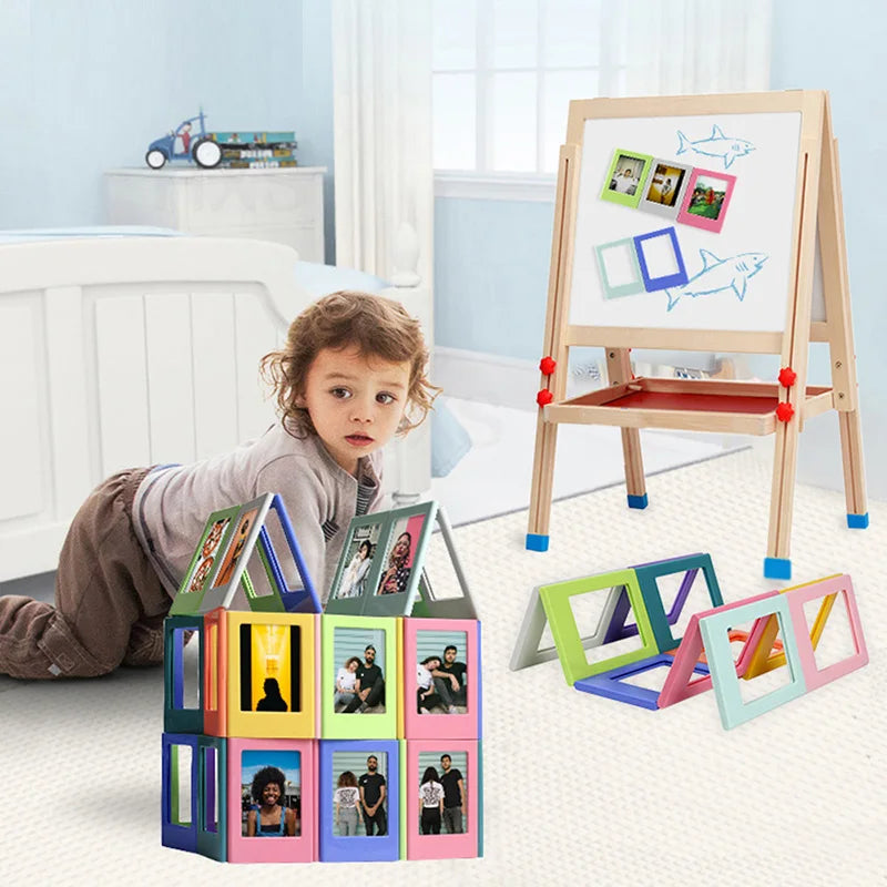 A collection of colorful magnetic photo frames displayed on a wooden easel and a white surface.