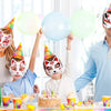 A family of three is wearing blank white cat half masks for DIY decoration and cosplay with colorful treats.