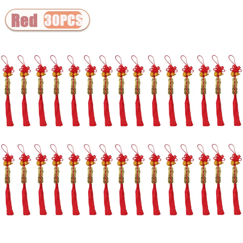 Red traditional Chinese knot pendants featuring wooden gourds and copper coins.