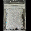A clear plastic pouch filled with iridescent nail rhinestones for DIY art.