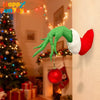A green monster arm with a red and white Santa hat is displayed as wall decor.