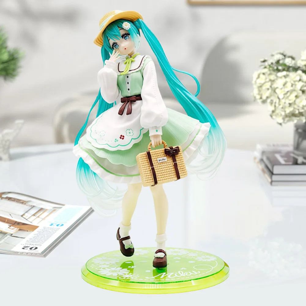 A PVC collectible figurine of Hatsune Miku in a green and white dress with long teal hair standing on a circular base.