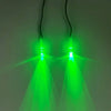 Pair of green LED glowing eyes illuminating a dark background.