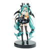 PVC collectible figurine of Hatsune Miku in a black and white outfit with long teal hair and a small doll.