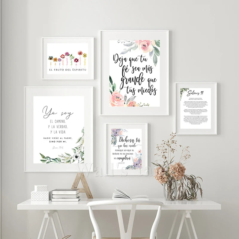 A collection of four framed canvas prints featuring Spanish Bible verses on a white wall.