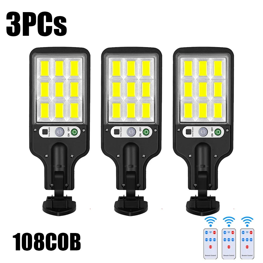 Three solar powered motion sensor security lights with 108 LED bulbs shown side by side.