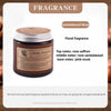 A jar of Sandalwood Rose floral fragrance candle with a gold lid and label