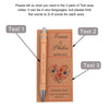 A set of personalized engraved bamboo pens with thank you cards featuring names and a floral design.