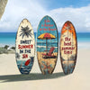 Three wooden surfboards with inspirational text on a beach background