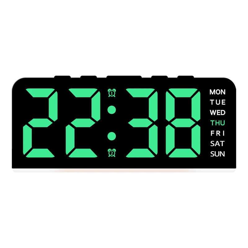 A black digital alarm clock displaying 22:38 with green LED numbers and day of the week indicators.