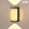 A rectangular, gold-toned LED crystal outdoor wall sconce with a waterproof finish mounted on a wall.
