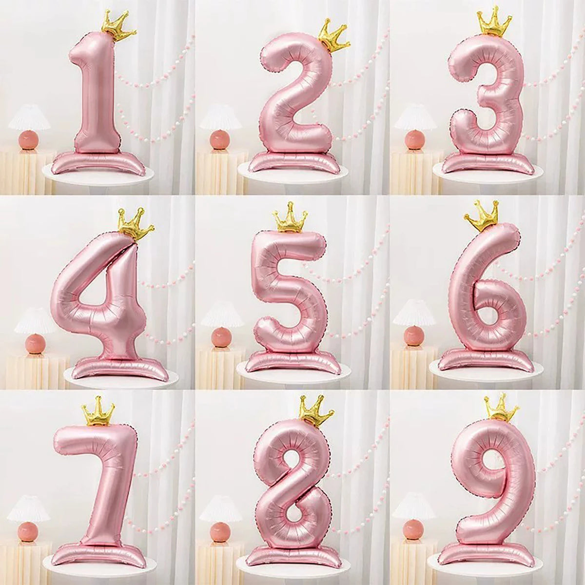A set of large pink foil number balloons from 1 to 9 displayed on white pedestals.
