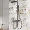 A silver shower head and hose fixture mounted on a white marble-patterned wall.