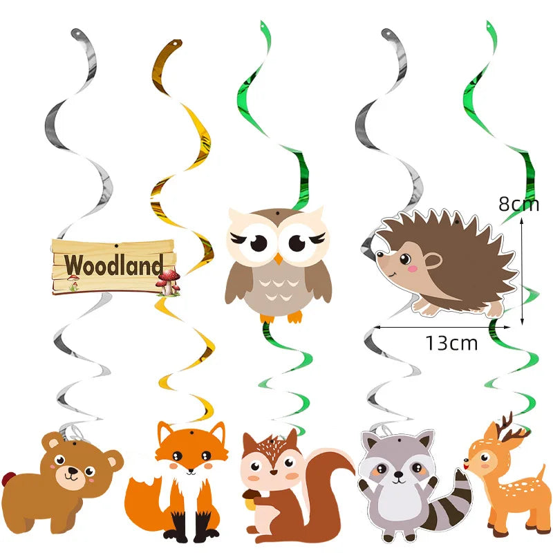 A collection of wooden and paper safari animal figures including an owl, a lion, a monkey, and a giraffe.