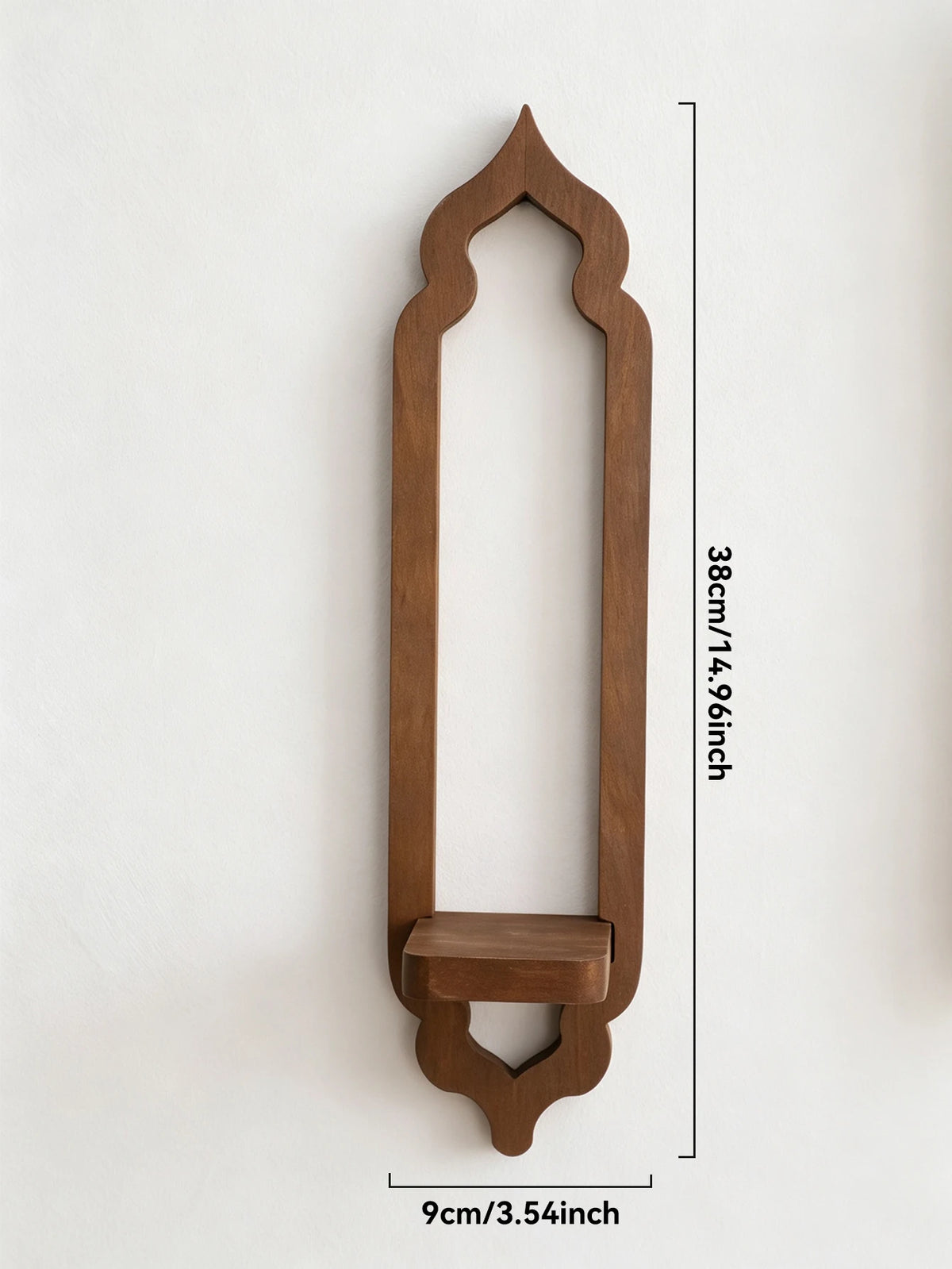 A vertical wooden arch wall shelf in a warm brown tone with an ogee top and decorative base.